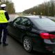 Policjanci ze Szczecina przy nieoznakowanym radiowozie BMW Fot. Policja